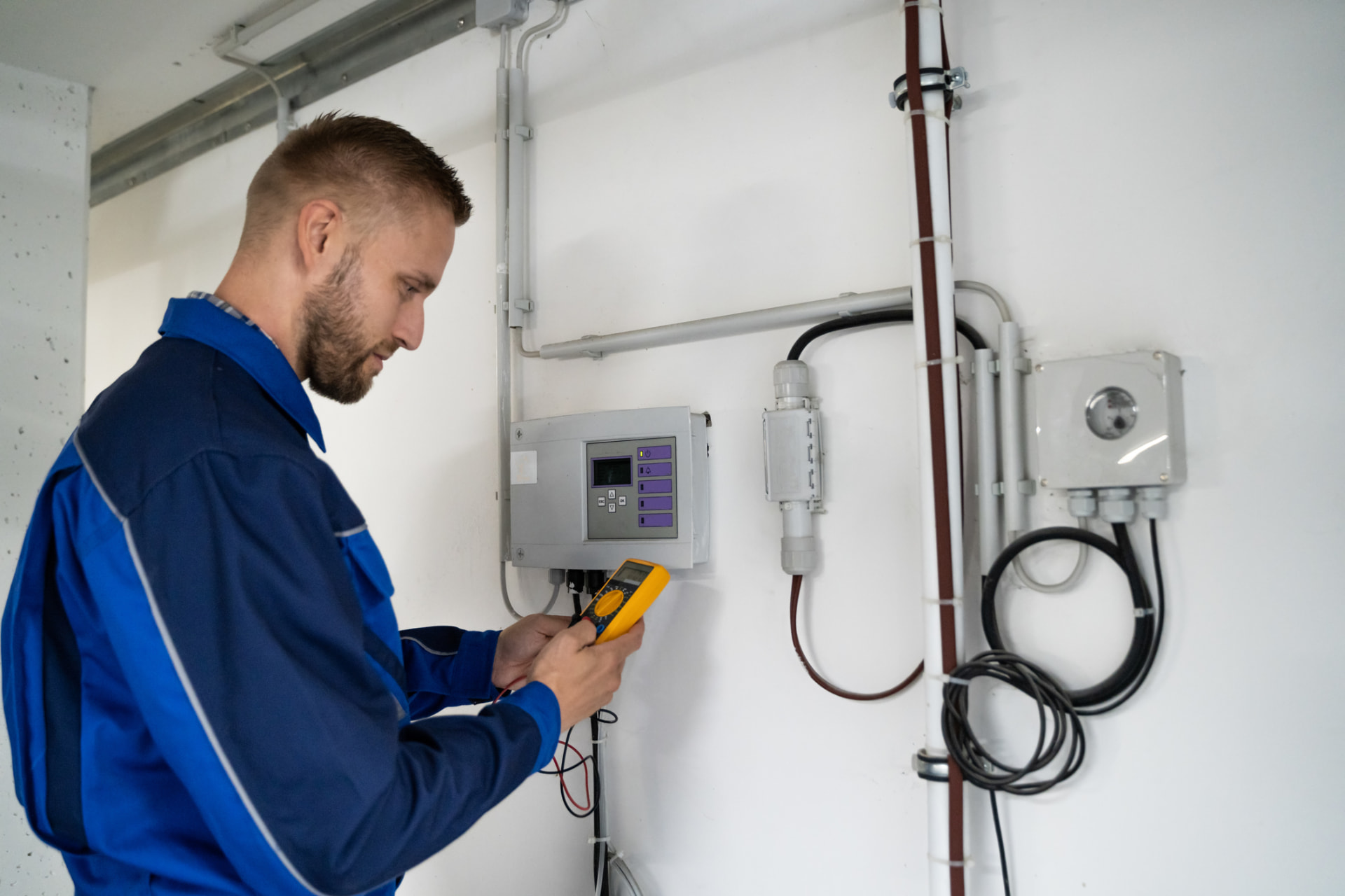 Technician testing fuel system controls during a scheduled fuel quality maintenance visit